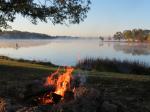 Morning fire overlooking the misty lake